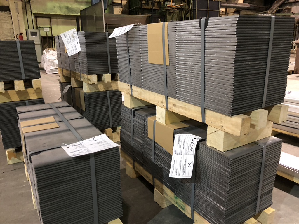 Palletised sheet cut-to-size pieces with delivery notes in the shipping warehouse